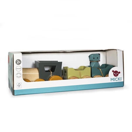 Kolejka drewniana z doczepionymi wagonami z motywem potwora Micki