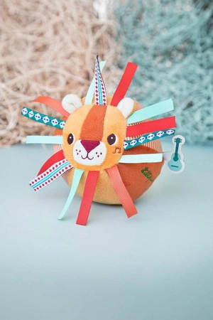 LILLIPUTIENS Piłeczka sensoryczna z dzwoneczkiem i wypustkami Lew Jack 6 m+