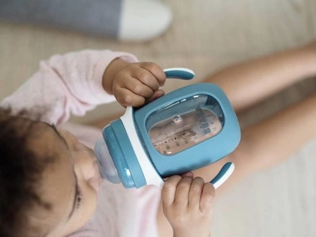 Beaba Szklana butelka treningowa w silikonowej osłonce 2w1 210 ml Windy blue