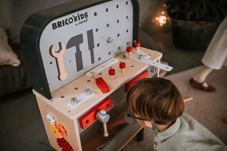 Dwustronny drewniany stolik warsztatowy z 34 akcesoriami Brico'kids 3-8 lat, Janod