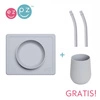 EZPZ Silikonowa miseczka z podkładką 2w1 Mini Bowl + GRATIS silikonowy kubeczek Mini Cup 120ml z 2 słomkami  pastelowa szarość