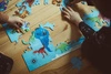 Mudpuppy Puzzle Świat dinozaurów z elementami w kształcie dinozaurów 80 elementów 5+